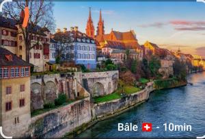 a view of a city with a river and buildings at Studio des Trois Frontières in Saint-Louis +1 photo