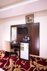 TV a/nebo společenská místnost v ubytování فندق المسار العزيزية