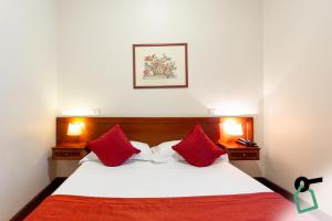 En eller flere senge i et værelse på Hotiday Roma Borghese