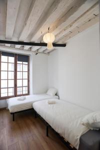 En eller flere senge i et værelse på Centre Poirier Architect Orléans I Exclusivité