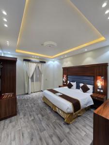 En eller flere senge i et værelse på ليالي أكنان للشقق المخدومة فرع2