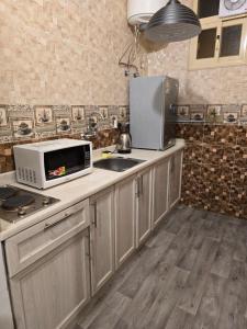 Køkken eller tekøkken på ليالي أكنان للشقق المخدومة فرع2