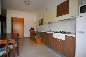 Køkken eller tekøkken på Residence Condominio ROMA