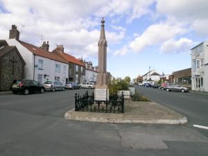 a monument in the middle of a street at Jenny Wren in Flamborough +2 photos
