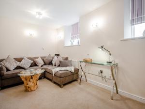 Et opholdsområde på Mews Cottage