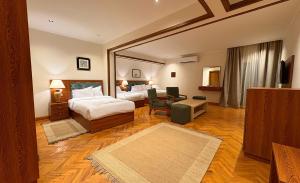 Postel nebo postele na pokoji v ubytování Kemet Boutique Hotel