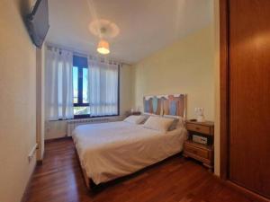 En eller flere senge i et værelse på Apartamento El Rinconín Selnatur