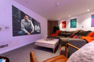 a living room with two couches and a large screen at St James Central Splendor in Bath +42 photos