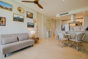 a living room with a couch and a table at 2BR apartment with balcony and amazing views in Pendales