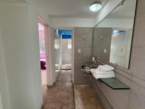 a bathroom with a sink and a mirror at Poseidon in Las Chacras (La Paz) +19 photos