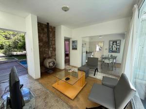 a living room with a couch and a table at Poseidon in Las Chacras (La Paz)