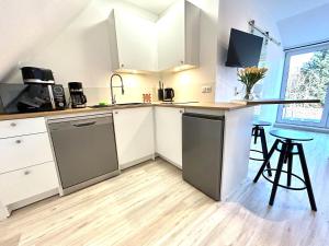 Кухня или мини-кухня в Ferienwohnung Loft Kirchdorf
