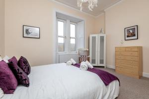 En eller flere senge i et værelse på Bonny Bay - Lower Largo