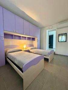 En eller flere senge i et værelse på Verdeacqua my villa in the pinewood