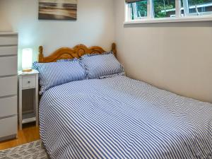 En eller flere senge i et værelse på Coastal Haven