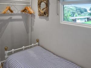 En eller flere senge i et værelse på Coastal Haven