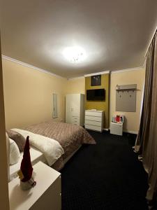 Ένα ή περισσότερα κρεβάτια σε δωμάτιο στο Udroiu Residence