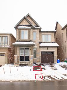 a house with a no parking sign in the snow at Oshawa Two Bedroom Private Suite in Oshawa