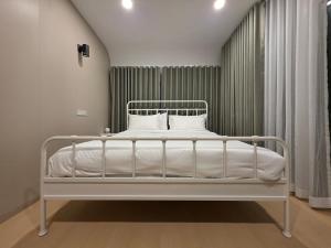 En eller flere senge i et værelse på The Montanas Resort Khaokho