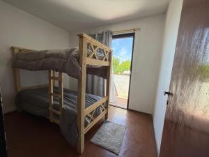 En eller flere senge i et værelse på Mi lugar en San Rafael