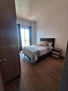 Giường trong phòng chung tại Refugio Urbano, Departamento Luis de Fuentes