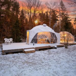 a yurt in a field with snow on the ground at Bubble House glamping tent Odulemma 