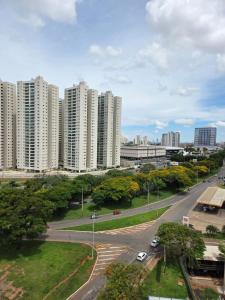 a view of a city with tall white buildings at Flat 1015 - Comfort Hotel Taguatinga in Brasilia