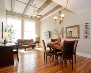 a dining room and living room with a table and chairs at The Valley in Vicksburg