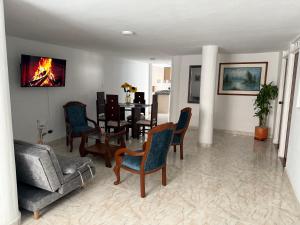 TV a/nebo společenská místnost v ubytování Confort y seguridad cerca a la basílica en Buga