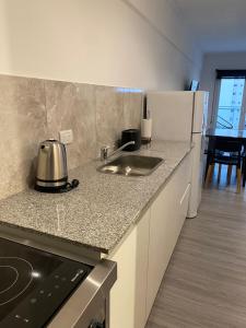 Køkken eller tekøkken på Departamento Senderos Mar y Parque B + 3 billeder