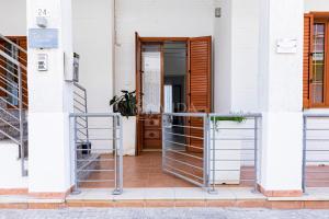 a entrance to a building with a glass door at InCentro b&b in Porto Cesareo