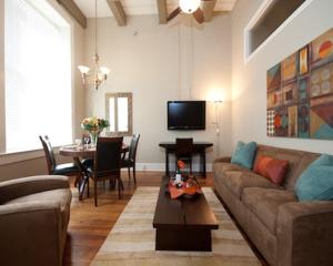 a living room with a couch and a table at The Valley in Vicksburg