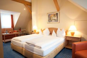 Postel nebo postele na pokoji v ubytování Hotel Mehl