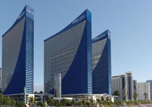two tall buildings in front of a city at ORBI CITY - Black Sea Apartments in Batumi
