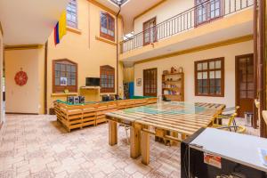a large room with a wooden table in it at Casa del Sol in Bogotá