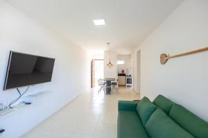 Et tv og/eller underholdning på Apto Pe na Areia em Ilheus - Cond Praia da Perola