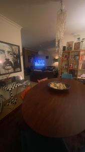 a pizza sitting on top of a table in a living room at Casa Praia Verde V3 in Castro Marim