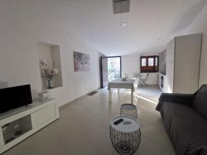 a living room with a couch and a table at Mare Apartment 4 in Scalea