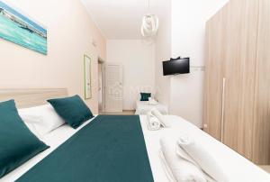 Giường trong phòng chung tại La Torre Apartments