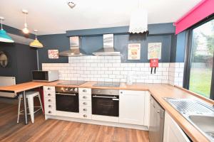 a kitchen with white cabinets and a counter top at 3 Private Rooms in Shared Apartment with Kitchen in Leeds