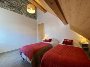 En eller flere senge i et værelse på Maison Féli'