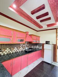 Køkken eller tekøkken på BHURBAN Family APARTMENTS