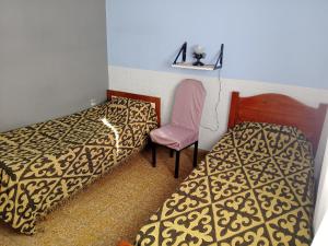 Giường trong phòng chung tại Depto