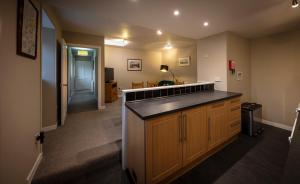 een grote keuken met een aanrecht en een hal bij Dunvegan Castle Laundry Cottage in Dunvegan