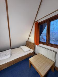 a room with two beds and a window at Twiste Retreat 126 in Bad Arolsen