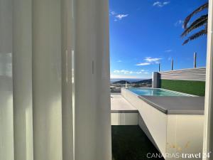 a view from the balcony of a house with a swimming pool at Los Roquitos II in El Paso