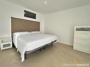 Postel nebo postele na pokoji v ubytování Los Roquitos II + 32 fotografií