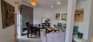 a living room with a couch and a table at city garden Kech in Marrakesh