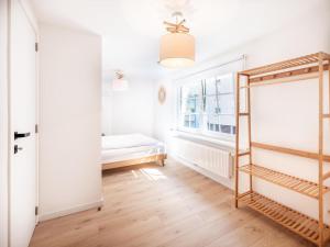 Ένα ή περισσότερα κρεβάτια σε δωμάτιο στο Ensemble