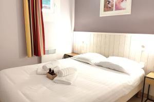 En eller flere senge i et værelse på Apartment for 6 - Residence Pierre & Vacances